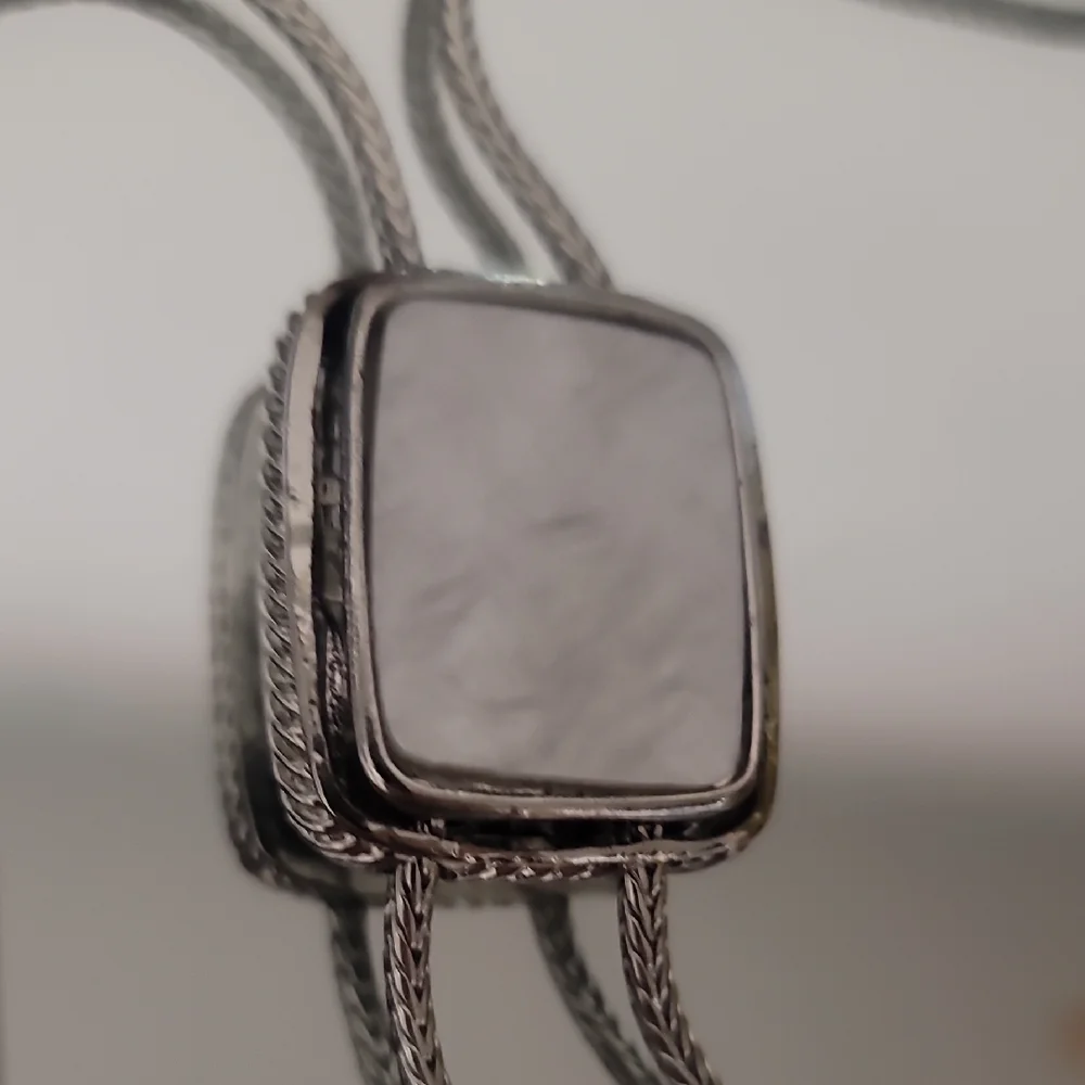 NWOT Silver Bolo Tie With Mother Of Perl Accent.